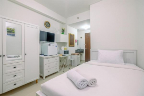 Minimalist and Cozy Studio (No Kitchen) Transpark Cibubur Apartment By Travelio